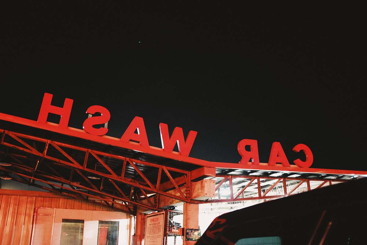 car wash red Car Wash cutout signage on top of roof sign